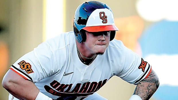 Oklahoma State's Griffin Doersching stops down at second to issue a gorilla pound on his chest during the NCAA Stillwater Regional baseball game between Oklahoma State Cowboys and Missouri State Bears at the O'Brate Stadium in Stillwater.